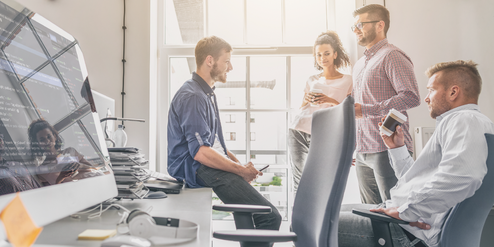 people chatting in an office